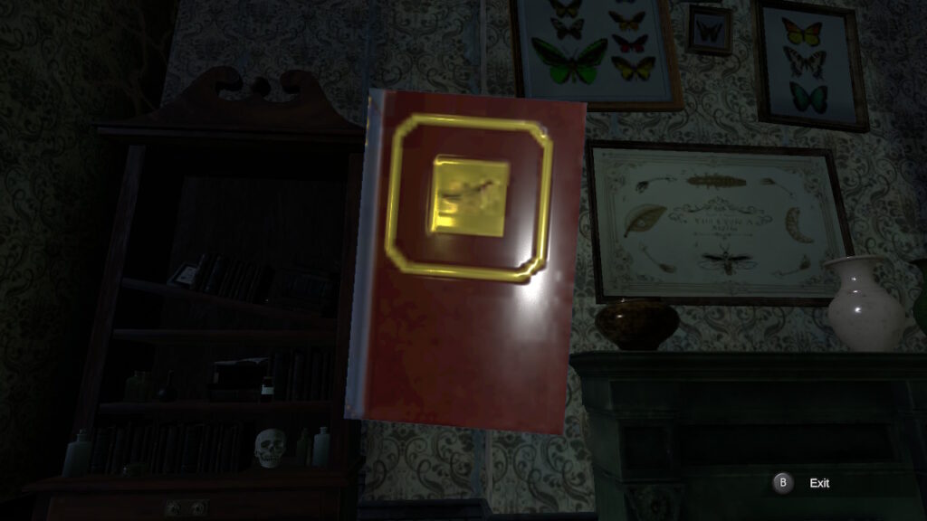 A red book with gold detailing held up against diagrams on the wall.