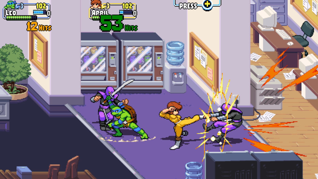 April and Leonardo fight members of the Foot Clan in an office